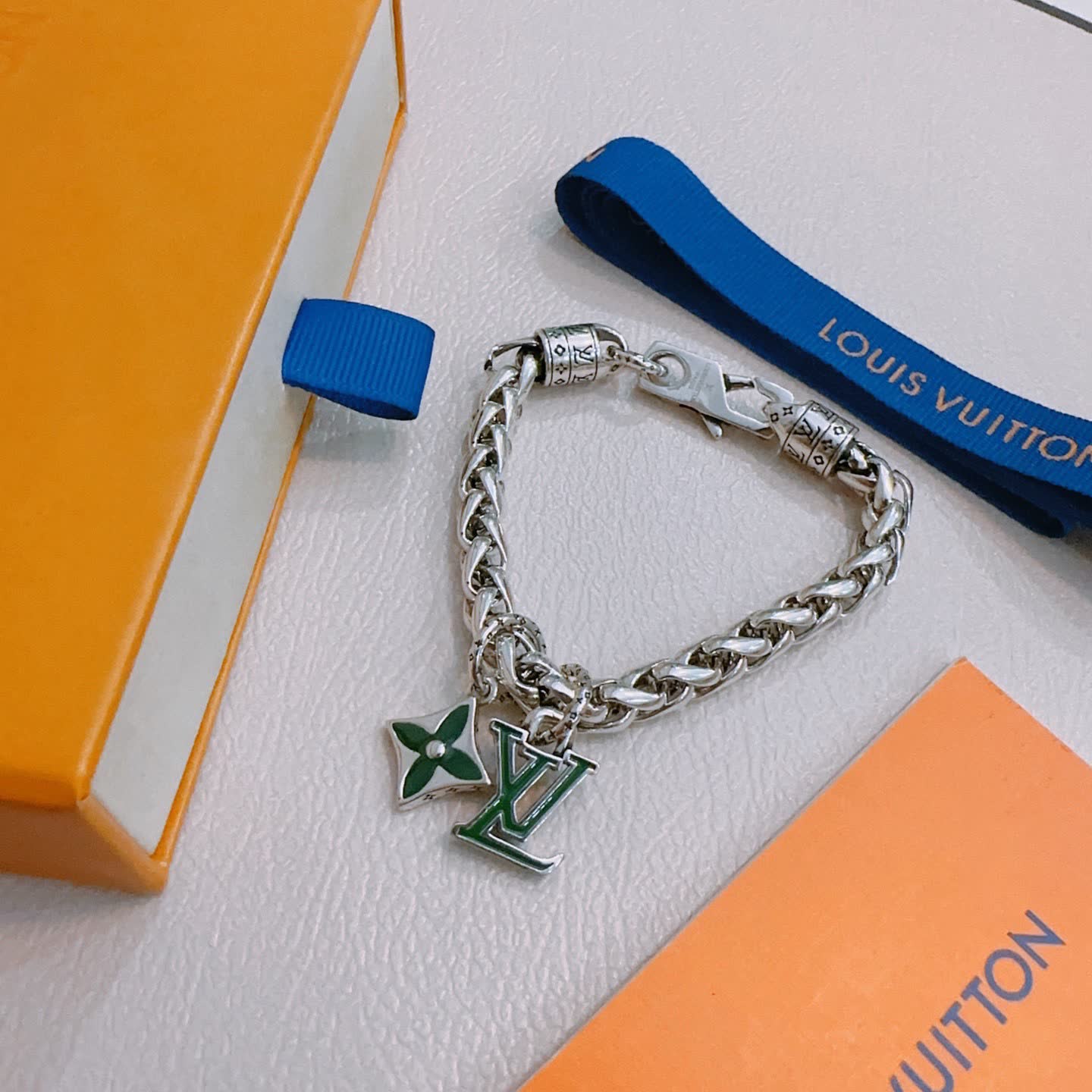 Louis Vuitton Silver Bracelet with LV Logo and Green Flower Charm